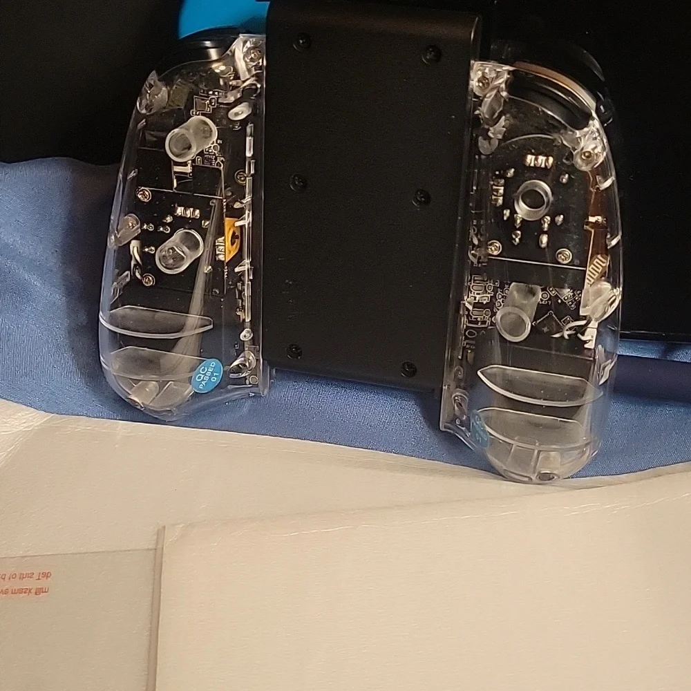 Nintendo Switch OLED with Neon Blue and Red Joy-Con Controllers.